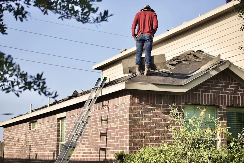 Professional roofer working on a residential roof in Sunnyland